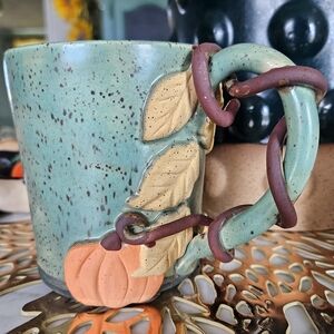 Handcrafted Green Ceramic Mug with Pumpkin Design